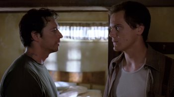 Movie still from “Bug” (2006), directed by William Friedkin – Two men standing next to each other in front of a window; Close Up shot, Low angle