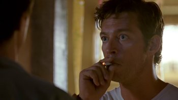 Movie still from “Bug” (2006), directed by William Friedkin – A person smoking a cigarette; Close Up shot, Low angle