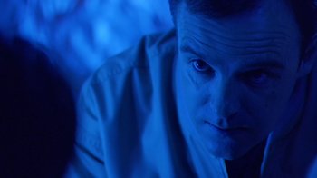 Movie still from “Bug” (2006), directed by William Friedkin – A person with blue eyes; Close Up shot, Low angle