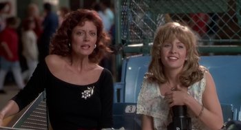 Movie still from “Bull Durham” (1988), directed by Ron Shelton – Two women sitting next to each other at a baseball game; Medium shot, Over the shoulder angle