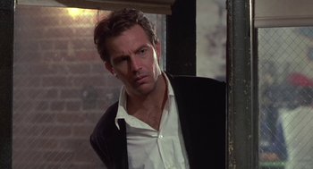 Movie still from “Bull Durham” (1988), directed by Ron Shelton – A person wearing a suit and tie; Close Up shot, Low angle