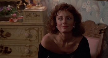 Movie still from “Bull Durham” (1988), directed by Ron Shelton – A person sitting in a room near a wall; Close Up shot, Over the shoulder angle