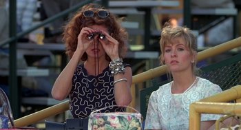 Movie still from “Bull Durham” (1988), directed by Ron Shelton – Two women sitting next to each other at a table; Medium shot, Over the shoulder angle