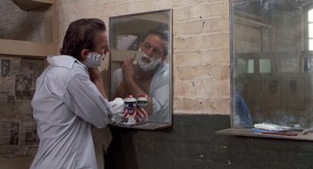 Movie still from “Bull Durham” (1988), directed by Ron Shelton – A man shaving his face in a mirror; Close Up shot, Over the shoulder angle