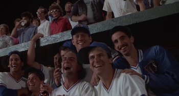 Movie still from “Bull Durham” (1988), directed by Ron Shelton – A group of baseball players posing for a picture; Medium shot, Low angle