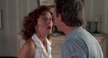 Movie still from “Bull Durham” (1988), directed by Ron Shelton – A man and a woman in front of each other face to face; Close Up shot, Over the shoulder angle