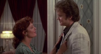Movie still from “Bull Durham” (1988), directed by Ron Shelton – A man and a woman standing next to each other in front of a window; Close Up shot, Over the shoulder angle
