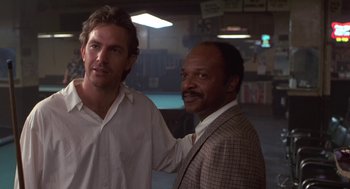 Movie still from “Bull Durham” (1988), directed by Ron Shelton – Two men standing next to each other in a room; Close Up shot, Low angle