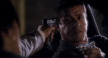 Movie still from “Bullet to the Head” (2012), directed by Walter Hill – Sylvester stallone in a scene from the movie ' escape plan '; Close Up shot, Over the shoulder angle