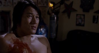 Movie still from “Bullet to the Head” (2012), directed by Walter Hill – A shirtless man with blood all over his body; Close Up shot, Over the shoulder angle