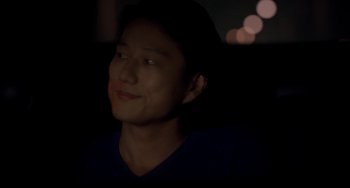 Movie still from “Bullet to the Head” (2012), directed by Walter Hill – A young man in the dark looking up at the sky; Close Up shot, Over the shoulder angle