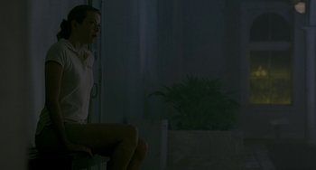 A person sitting on a chair in a room