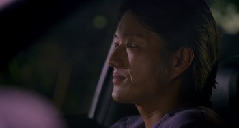 Movie still from “Bullet to the Head” (2012), directed by Walter Hill – A person sitting in a car; Close Up shot, Over the shoulder angle