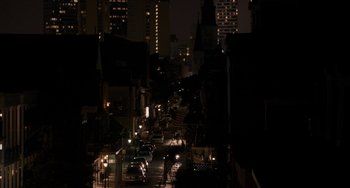 Movie still from “Bullet to the Head” (2012), directed by Walter Hill – A city street at night lit up by street lights; Extreme Wide shot, High angle