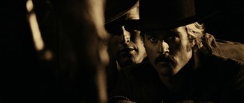 Movie still from “Butch Cassidy and the Sundance Kid” (1969), directed by George Roy Hill – A man in a cowboy hat and another man in a cowboy hat; Close Up shot, Over the shoulder angle