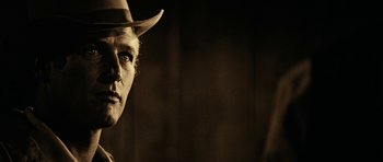 Movie still from “Butch Cassidy and the Sundance Kid” (1969), directed by George Roy Hill – A man wearing a cowboy hat in a black and white photo; Close Up shot, Low angle