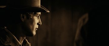 Movie still from “Butch Cassidy and the Sundance Kid” (1969), directed by George Roy Hill – A person wearing a hat; Close Up shot, Over the shoulder angle