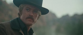Movie still from “Butch Cassidy and the Sundance Kid” (1969), directed by George Roy Hill – A person wearing a hat; Close Up shot, Low angle