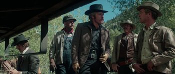 Movie still from “Butch Cassidy and the Sundance Kid” (1969), directed by George Roy Hill – A group of men standing next to each other holding guns; Medium shot, Low angle