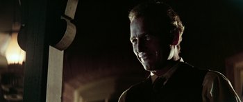 Movie still from “Butch Cassidy and the Sundance Kid” (1969), directed by George Roy Hill – A person wearing a suit and tie; Close Up shot, Low angle