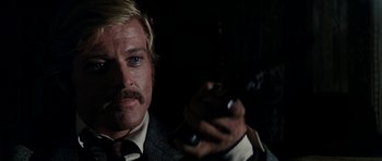 Movie still from “Butch Cassidy and the Sundance Kid” (1969), directed by George Roy Hill – A person holding a cell phone; Close Up shot, Over the shoulder angle