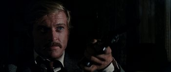 Movie still from “Butch Cassidy and the Sundance Kid” (1969), directed by George Roy Hill – A person holding a cell phone; Close Up shot, Over the shoulder angle