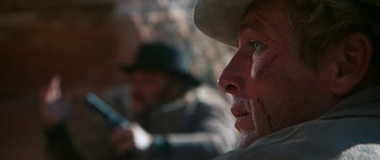 Movie still from “Butch Cassidy and the Sundance Kid” (1969), directed by George Roy Hill – A person wearing a cowboy hat; Close Up shot, Over the shoulder angle