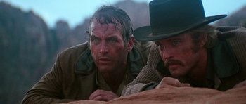 Movie still from “Butch Cassidy and the Sundance Kid” (1969), directed by George Roy Hill – A man with blue eyes and a cowboy hat on; Close Up shot, Low angle