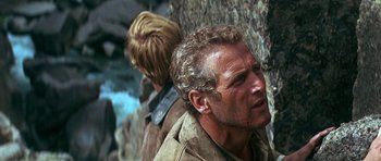 Movie still from “Butch Cassidy and the Sundance Kid” (1969), directed by George Roy Hill – A man in a brown shirt and a blond boy in a brown shirt; Close Up shot, Over the shoulder angle