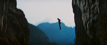 Movie still from “Butch Cassidy and the Sundance Kid” (1969), directed by George Roy Hill – A man flying through the air while riding a skateboard; Extreme Wide shot, Overhead angle