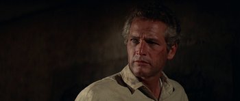 Movie still from “Butch Cassidy and the Sundance Kid” (1969), directed by George Roy Hill – A person wearing a white shirt; Close Up shot, Low angle