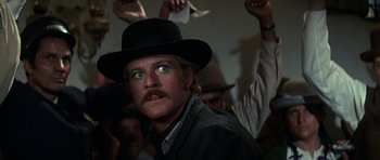 Movie still from “Butch Cassidy and the Sundance Kid” (1969), directed by George Roy Hill – A person wearing a hat; Close Up shot, Low angle