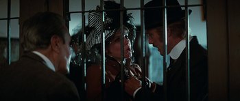Movie still from “Butch Cassidy and the Sundance Kid” (1969), directed by George Roy Hill – A man and a woman in a cage; Medium shot, Over the shoulder angle