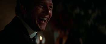 Movie still from “Butch Cassidy and the Sundance Kid” (1969), directed by George Roy Hill – A man's face in a dark room; Close Up shot, Over the shoulder angle