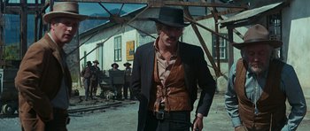 Movie still from “Butch Cassidy and the Sundance Kid” (1969), directed by George Roy Hill – A man wearing a hat and a suit and tie; Medium shot, Low angle