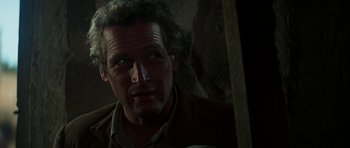 Movie still from “Butch Cassidy and the Sundance Kid” (1969), directed by George Roy Hill – A person wearing a brown jacket; Close Up shot, Low angle