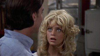 Movie still from “Butterflies Are Free” (1972), directed by Milton Katselas – A man and a woman looking at one another; Close Up shot, Over the shoulder angle