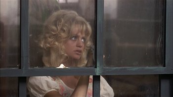 Movie still from “Butterflies Are Free” (1972), directed by Milton Katselas – A woman looking out of a window at the outside; Close Up shot, Over the shoulder angle