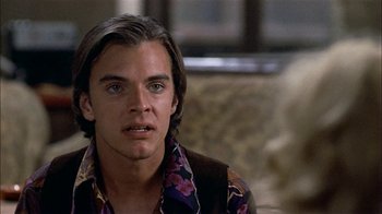 Movie still from “Butterflies Are Free” (1972), directed by Milton Katselas – A person with long hair; Close Up shot, Over the shoulder angle