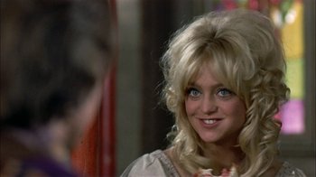 Movie still from “Butterflies Are Free” (1972), directed by Milton Katselas – A woman with blonde hair and blue eyes; Close Up shot, Over the shoulder angle