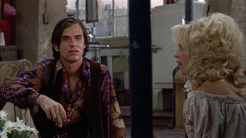 Movie still from “Butterflies Are Free” (1972), directed by Milton Katselas – A man and a woman are talking in a room; Medium shot, Over the shoulder angle