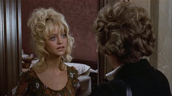Movie still from “Butterflies Are Free” (1972), directed by Milton Katselas – A young woman with long blonde hair looking into a mirror; Close Up shot, Over the shoulder angle