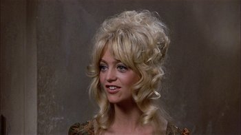Movie still from “Butterflies Are Free” (1972), directed by Milton Katselas – A woman with blonde hair is smiling for the camera; Close Up shot, High angle
