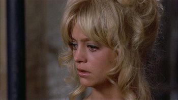 Movie still from “Butterflies Are Free” (1972), directed by Milton Katselas – A person with long blonde hair; Close Up shot, High angle