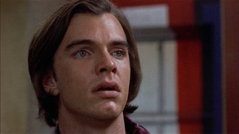 Movie still from “Butterflies Are Free” (1972), directed by Milton Katselas – A person with long brown hair; Close Up shot, Low angle