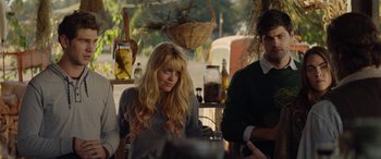 Movie still from “Cabin Fever” (2016), directed by Travis Zariwny – A woman sitting at a table with a man; Medium shot, Over the shoulder angle