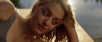 Movie still from “Cabin Fever” (2016), directed by Travis Zariwny – A woman's face with her hand on her head; Close Up shot, Low angle