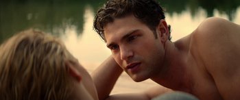 Movie still from “Cabin Fever” (2016), directed by Travis Zariwny – A person laying on the ground; Close Up shot, Over the shoulder angle