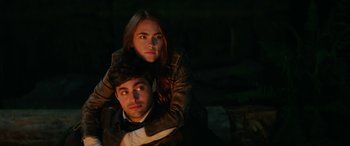 Movie still from “Cabin Fever” (2016), directed by Travis Zariwny – A man and a woman pose for a picture; Close Up shot, Over the shoulder angle