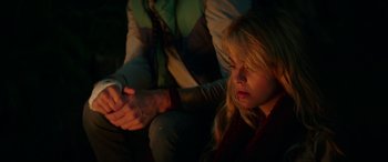 Movie still from “Cabin Fever” (2016), directed by Travis Zariwny – A woman sitting next to a man holding her hand; Close Up shot, Over the shoulder angle